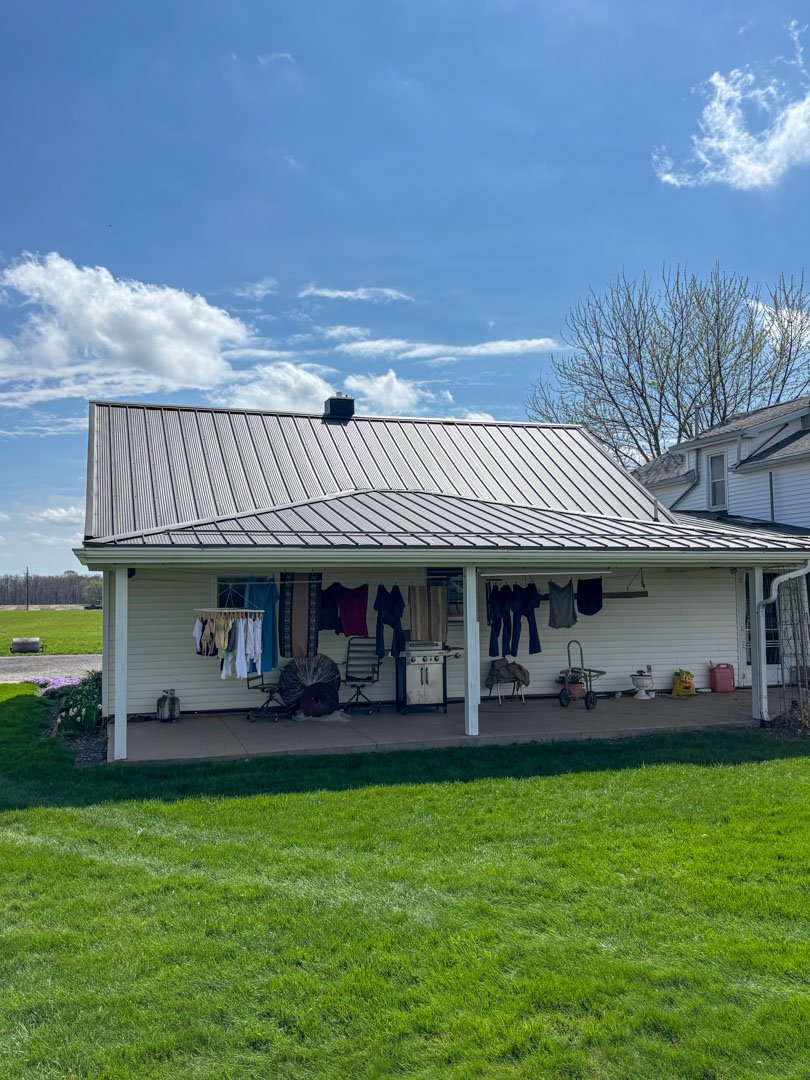 Covered porch and outdoor living area attached to a home